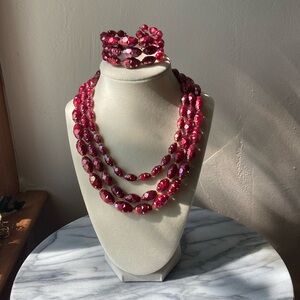 Signed Austria vintage three strand cranberry beaded necklace and bracelet set.